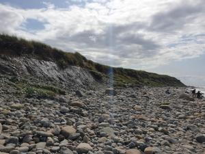 a large pile of rocks on a rocky beach at 6 person holiday home in Hirtshals in Hirtshals
