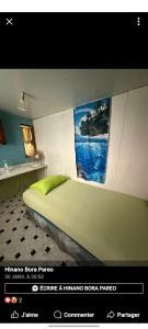 Ένα ή περισσότερα κρεβάτια σε δωμάτιο στο Chez Hinano SIKI