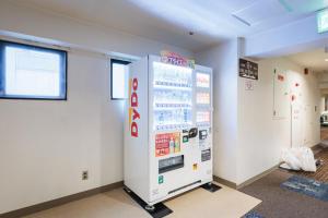 a gas station with a machine in a room at Nagoya Sakae Green Hotel in Nagoya