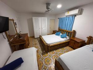 Postel nebo postele na pokoji v ubytování Hotel Casa Confort Cartagena