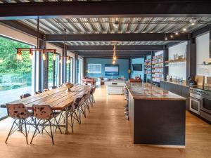 a large dining room with a long table and chairs at Chapelburn in Lawers