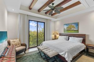 a bedroom with a bed and a large window at Treetop Ocean View Penthouse - Jobo 15 in Playa Conchal