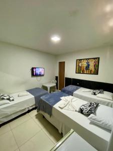 Ένα ή περισσότερα κρεβάτια σε δωμάτιο στο Pousada O auto da Compadecida