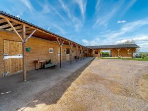 a large building with a large driveway in front of it at Stable View Barn - Uk45938 in Corley