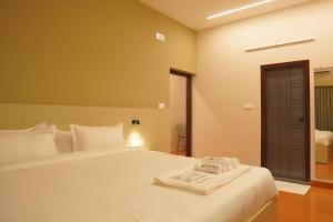 Giường trong phòng chung tại Hotel Spacio