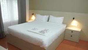 Giường trong phòng chung tại Hotel Spacio