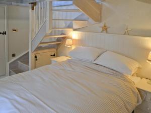 Ένα ή περισσότερα κρεβάτια σε δωμάτιο στο Driftwood