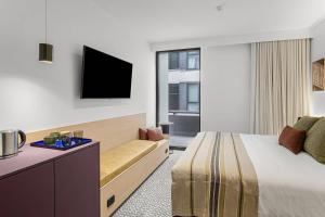 Postel nebo postele na pokoji v ubytování Urban Rest Hackney Hotel