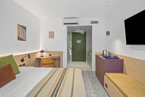 TV a/nebo společenská místnost v ubytování Urban Rest Hackney Hotel + 10 fotografií