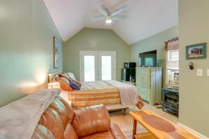 a bedroom with a bed and a couch at Secluded Mountain Cabin with Decks and Gazebo! in Brasstown