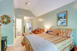 a bedroom with a large bed and a couch at Secluded Mountain Cabin with Decks and Gazebo! in Brasstown