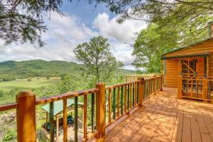 a log cabin with a deck with a view at Secluded Mountain Cabin with Decks and Gazebo! in Brasstown