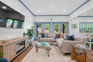 a living room with a couch and a table at Spacious, Peaceful, Historic - 3 Minute Walk to the Square in Georgetown