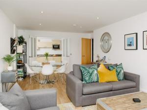 a living room with a couch and a table at 50 Bredon Court in Newquay