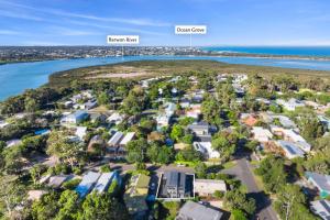 an aerial view of a suburb next to the water at Riverhaus Luxe Barwon Heads Retreat with Pool in Barwon Heads