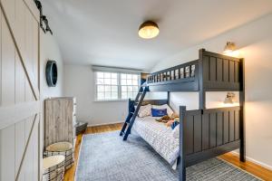 a bedroom with a bunk bed and a ladder at Stunning Westhampton Beach Home with Private Pool in Westhampton Beach +34 photos