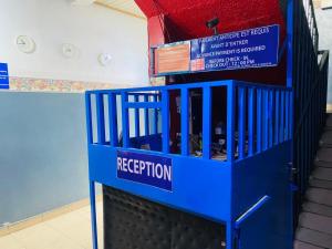 a blue crate with registration on it in a store at Flat Hôtel Alpha in Kinshasa