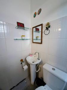 Koupelna v ubytování Apartamento Perequê Lá da Ilha + 7 fotografií