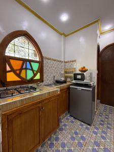 Kuchyň nebo kuchyňský kout v ubytování Apartamento Medina antiqo