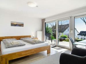 Ένα ή περισσότερα κρεβάτια σε δωμάτιο στο Holiday apartment in Meersburg with Wi-Fi