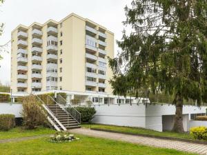 an apartment building with a staircase in front of it at Holiday apartment with 1 bedroom in Meersburg