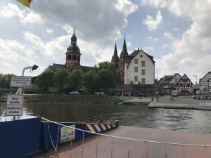 a view of a river in a city with buildings at Spessart Romanticism in Blankenbach +12 photos
