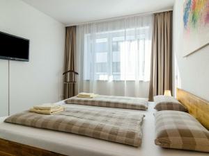 En eller flere senge i et værelse på Apartment in Überlingen with swimming pool