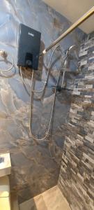 a room with a stone wall with a camera on it at Departamento en Nuevo Chimbote in Chimbote