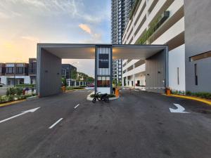 a motorcycle parked in the middle of a parking lot at Seruang Cozy Stay in Teluk Panglima Garang
