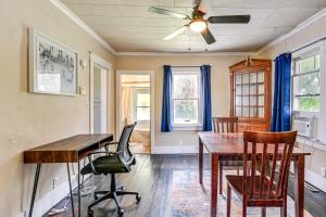 a dining room with a table and chairs and a ceiling fan at 3 Mi to Dtwn Saginaw Cozy Family Home with Yard! in Saginaw +16 photos
