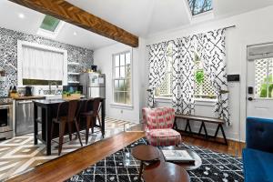 an open kitchen with a table and chairs at Modern Midtown-The Carriage House -Free Parking in Atlanta