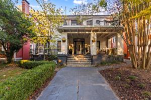 a home with a walkway leading to the front door at Modern Midtown-The Carriage House -Free Parking in Atlanta