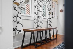 a wooden bench in front of a door at Modern Midtown-The Carriage House -Free Parking in Atlanta +44 photos