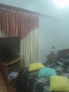 Postel nebo postele na pokoji v ubytování La Ilusión