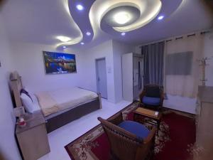 Ένα ή περισσότερα κρεβάτια σε δωμάτιο στο presti royal services