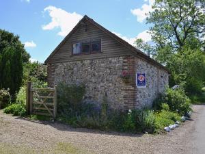 a brick building with a window on the side of it at The Stable in Crundale