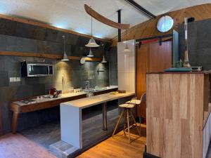 a kitchen with a sink and a counter in a room at Loft acogedor en el campo in Putaendo