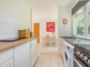 a kitchen with a sink and a dishwasher at Keepers Wood - W43109 in Bradworthy