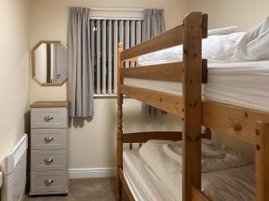 Postel nebo postele na pokoji v ubytování Ashbrooke- Hewetson Court