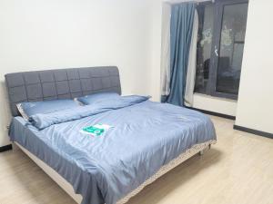 Ένα ή περισσότερα κρεβάτια σε δωμάτιο στο Capital International Home +3 φωτογραφίες