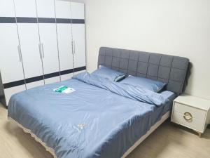 Postel nebo postele na pokoji v ubytování Capital International Home