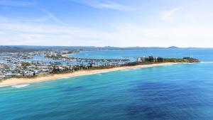 an aerial view of a beach and the ocean at Beachfront with pool ocean views and pet friendly in Buddina +42 photos