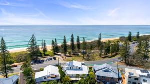 an aerial view of a resort and the ocean at Beachfront with pool ocean views and pet friendly in Buddina
