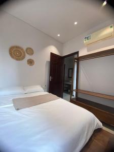 Postel nebo postele na pokoji v ubytování Pillow Homestay - Góc Mộc Mạc + 20 fotografií