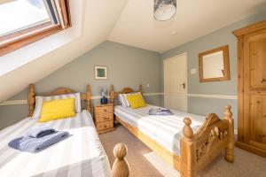 Ένα ή περισσότερα κρεβάτια σε δωμάτιο στο Clematis-Y-Ffynnon