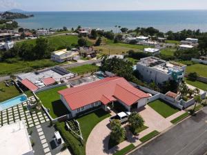 an aerial view of a house with a red roof at Family Beach House with an Amazing Ocean View in Naguabo