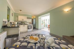 a kitchen with a table with two plates on it at Eiddew-Y-Ffynnon in Llanfyrnach