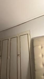 two closets in a room with a white wall at A pasos del Alto Vintge in Rosario