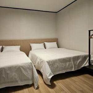 Ένα ή περισσότερα κρεβάτια σε δωμάτιο στο 부산데이즈 +12 φωτογραφίες