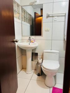 a bathroom with a toilet and a sink at ECOTERRA-SAN FRANCISCO Cusco in Cusco +32 photos